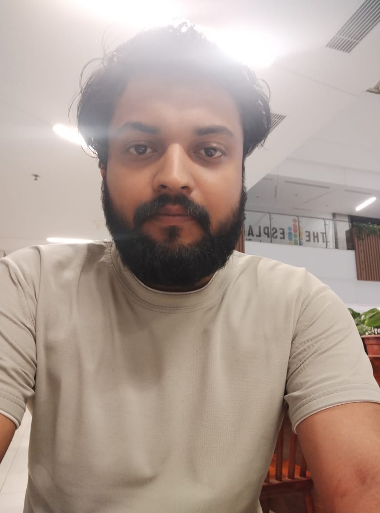 A headshot of Aditya Kumar Singh, a smiling man with short black hair.